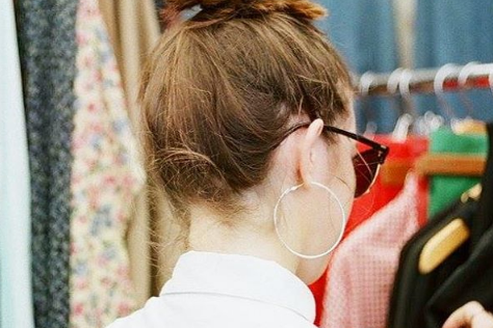 Siomha effortlessly carrying off the top knot hairstyle at a flea market in Brooklyn, New York. Photo: Siomha Connolly Instagram