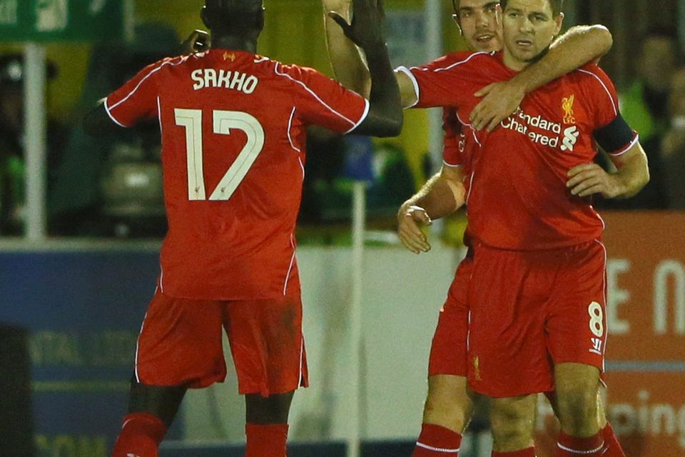 Liverpool's Steven Gerrard (R) celebrates after scoring