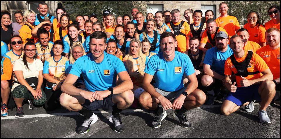 Dwayne Edgar and Karl Taaffe with members of Inner City Running Club in 2021. Pic: Steve Humphreys