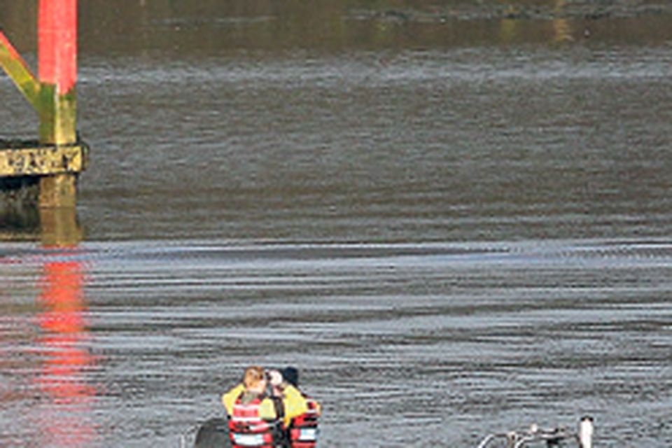 Rescue teams search the River Foyle for the body of Kieran McKeon after Alexandra O’Brien’s remains were taken from the river.