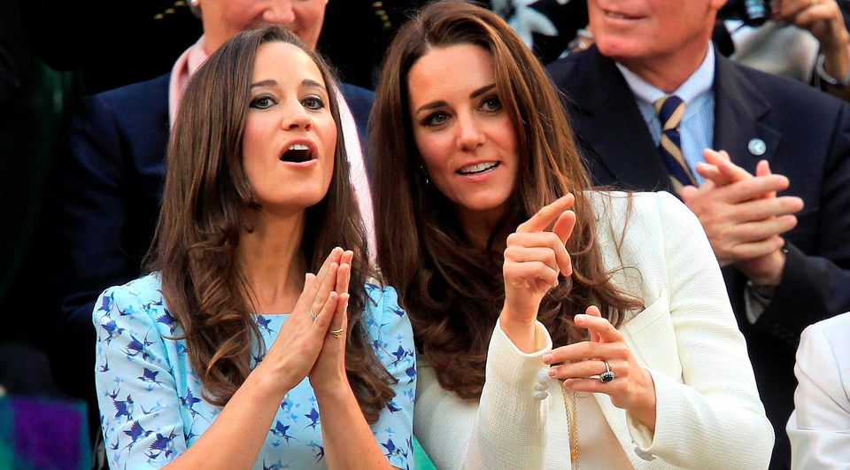 The Duchess of Cambridge and sister Pippa Middleton (left) attending the the Men's Singles Final during day thirteen of the 2012 Wimbledon Championships at the All England Lawn Tennis Club, Wimbledon