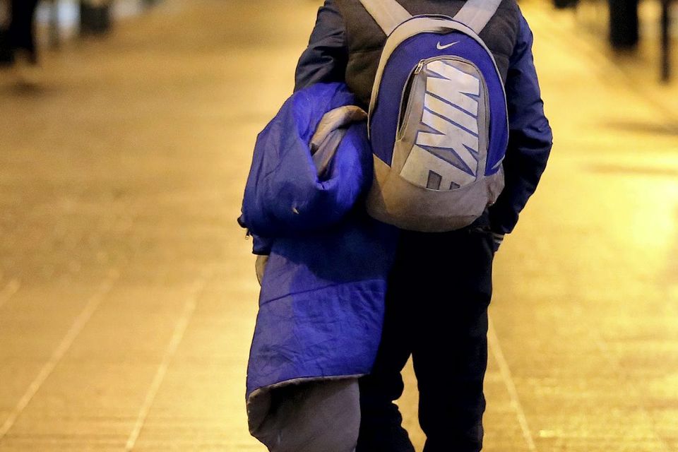 A homeless man walking on Dublin’s Grafton Street