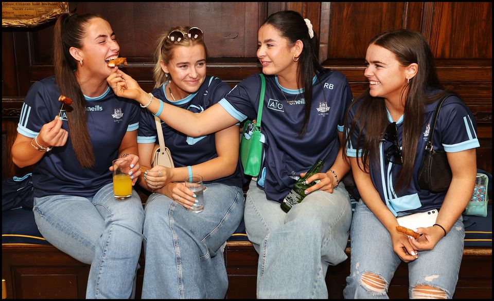 Members of the Dublin All Ireland Ladies Team celebrate their win at the Mansion House after they arrived for a reception there. Picture: Steve Humphreys