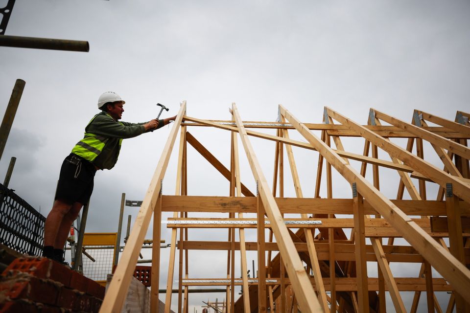 Without addressing the labour-supply constraints in the building sector not one additional home can be built in any one year. Photo: Bloomberg