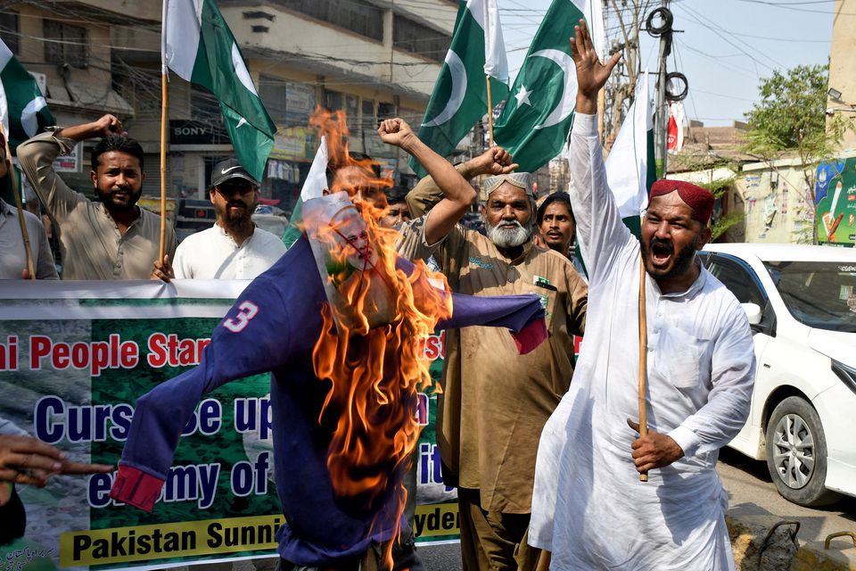 Demonstrators burn an effigy during an anti-India protest following India's military strikes on Pakistan, in Hyderabad, Pakistan. Photo: Reuters