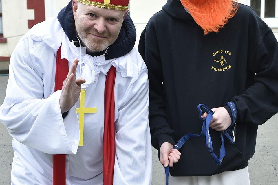Martin and Eoghan Byrne with Zeus at the St Patrick's Day parade in Coolgreany. Pic: Jim Campbell