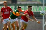 thumbnail: Kevin Flahive of Cork in action against Seán OShea of Kerry