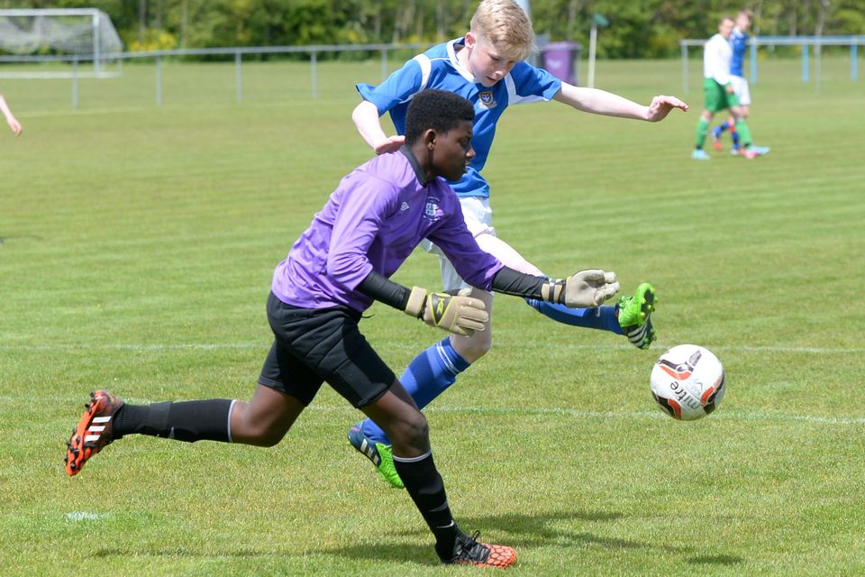 19/05/15. Glenn Hollywood and Joseph Bankole during the Under 15s soccer final between Colaiste Phadraig CBS and Templeouge College at Peamount Utd.
Pic: Justin Farrelly.