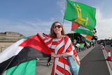 thumbnail: Linda Kerr from Dublin waves a Palestine flag before the start of the Kneecap concert in Fairview Park last week. Photo: Frank McGrath