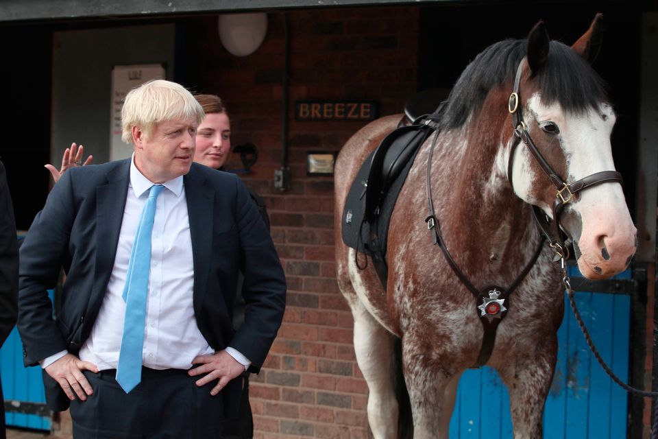 Why the long face?: Boris Johnson in West Yorkshire yesterday after he promised £750m to recruit an extra 20,000 police officers.
Photo: PA