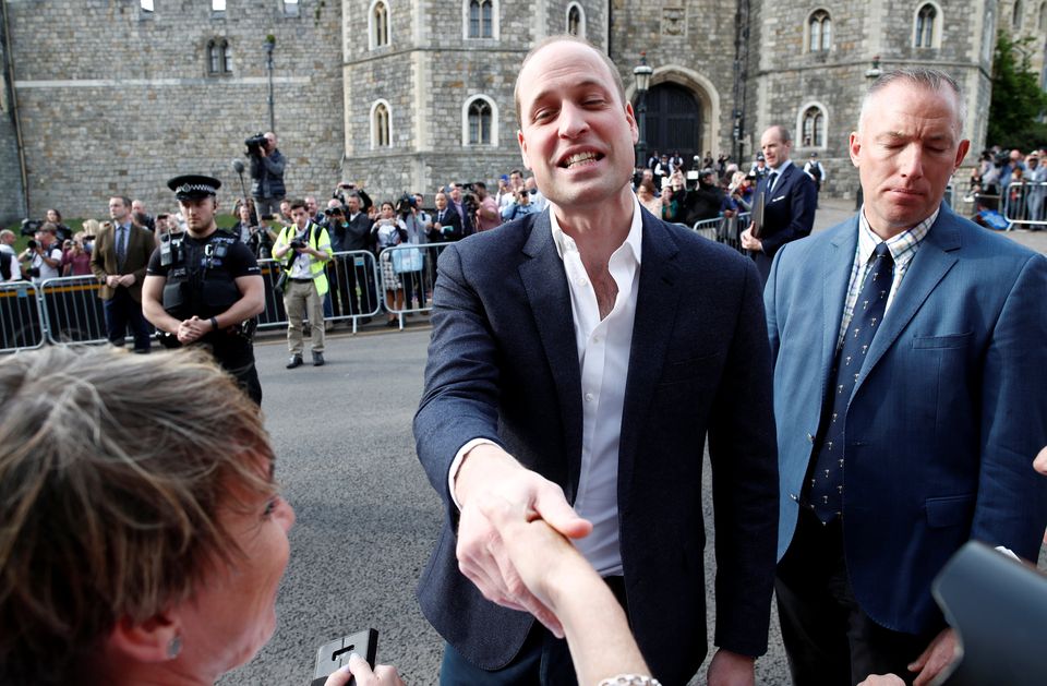 Britain's Prince William greets wellwishers outside Windsor Castle ahead of Prince Harry's wedding to Meghan Markle tomorrow, in Windsor, Britain, May 18, 2018. REUTERS/Damir Sagolj