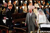 thumbnail: Prince Harry looks at his bride, Meghan Markle, as she arrives accompanied by Prince Charles, Prince of Wales during their wedding in St George's Chapel at Windsor Castle on May 19, 2018 in Windsor, England. (Photo by Jonathan Brady - WPA Pool/Getty Images)