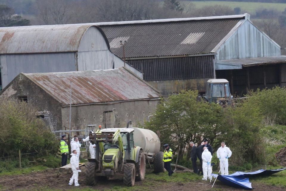 A garda forensic team at the scene at the farm at Fawnagowan, Tipperary, where the body of Bobby Ryan was discovered in a slurry pit. Photo: Liam Burke/Press 22