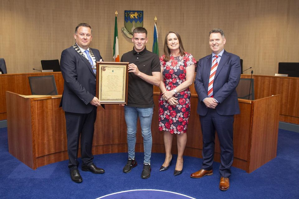 Cathaoirleach of the Wicklow Municipal District Paul O'Brien, CEO of Wicklow County Council Emer O'Gorman and Brian Gleeson present Adam Sinnott with the Cathaoirleach's Achievements and Contributions to Sport Award at a Civic Reception in Council Buildings, Wicklow town.