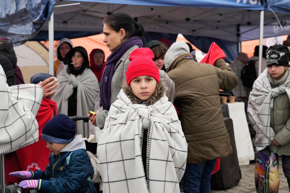 Refugees queue after fleeing from Ukraine at the border crossing in Medyka, south-east Poland. Photo: Sergei Grits/AP