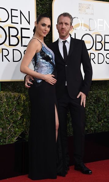 Actress Gal Gadot (L) and husband Yaron Versano arrive at the 74th annual Golden Globe Awards, January 8, 2017, at the Beverly Hilton Hotel in Beverly Hills, California.  / AFP / VALERIE MACON        (Photo credit: VALERIE MACON/AFP/Getty Images)