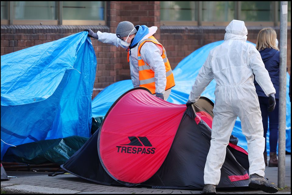 Workers remove 'tent city' in Mount Street, Dublin, last week. Photo: Steve Humphreys