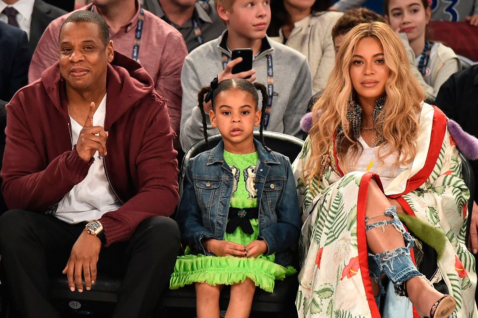 (L-R) Jay Z, Blue Ivy Carter and Beyoncé Knowles attend the 66th NBA All-Star Game at Smoothie King Center on February 19, 2017 in New Orleans, Louisiana. (Photo by Theo Wargo/Getty Images)