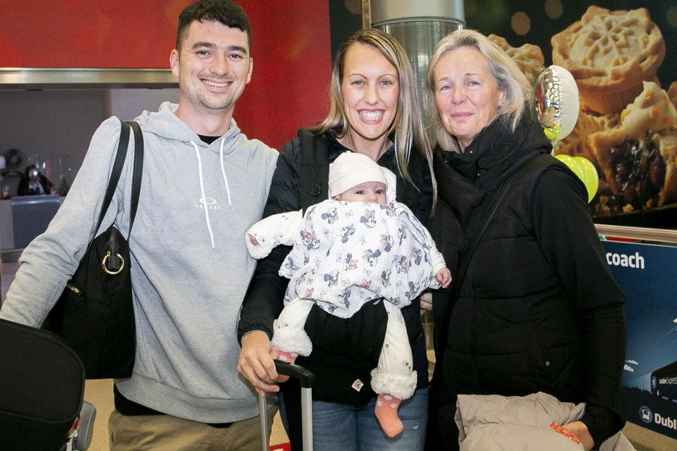 Jordan Williams, Emma O Sullivan and their baby Eva Mae (4 months) all from Brisbane are greeted by Cathy O'Sullivan from Cork. Photo: Gareth Chaney/ Collins Photos