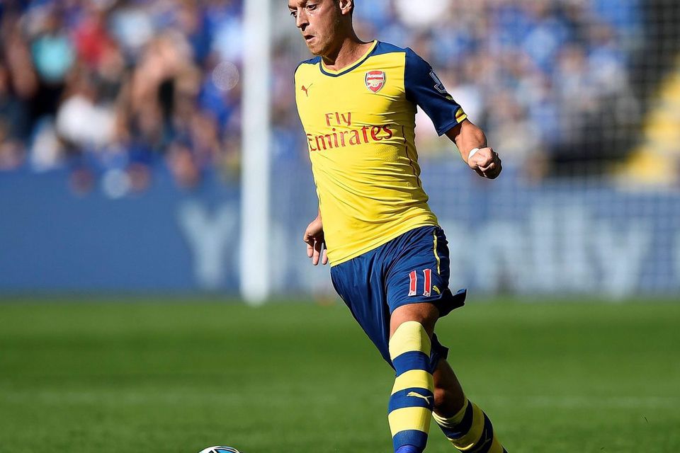 Arsenal's Mesut Ozil controls the ball during their match against Leicester City