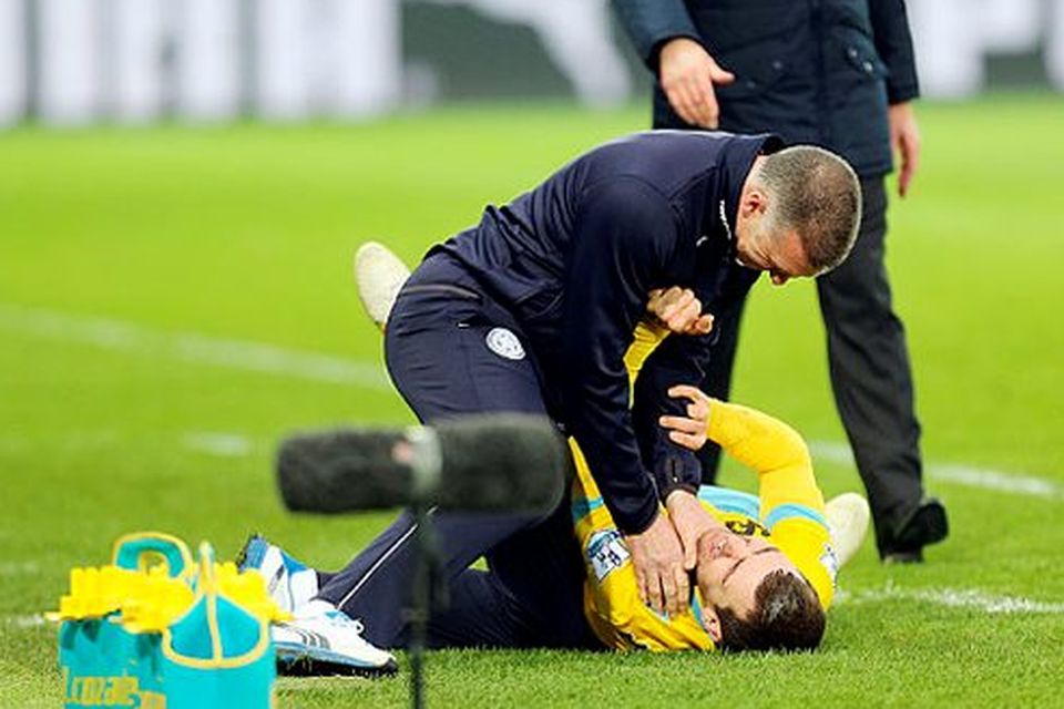 Under pressure: Nigel Pearson gets his hands round the throat of James McArthur