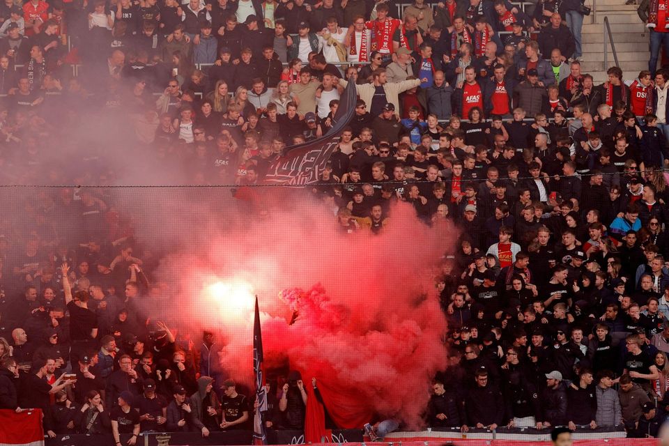 AZ Alkmaar fans light flares during the match against West Ham United last week which ended in violent confrontations.
