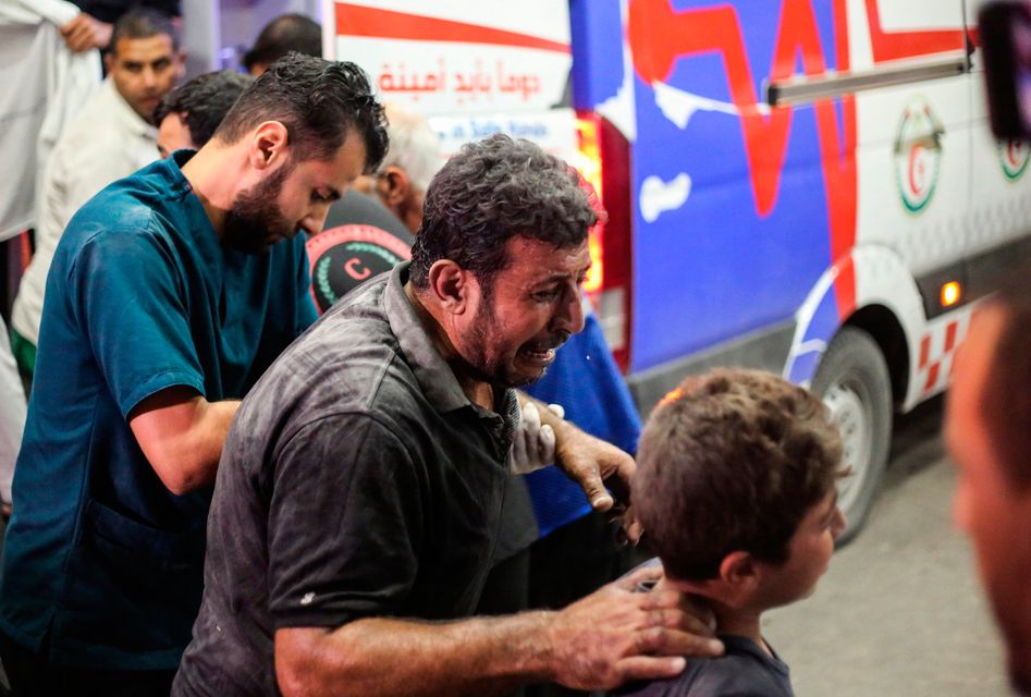 Palestinians injured in Israeli raids arrive in Khan Yunis, in the southern Gaza Strip, Gaza.. (Photo by Ahmad Hasaballah/Getty Images)