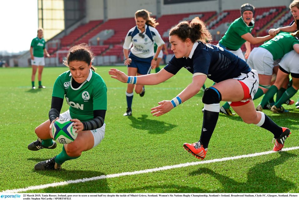 Tania Rosser, Ireland, goes over to score a second half try despite the tackle of Mhairi Grieve, Scotland