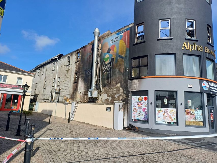 Extensive smoke damage was caused to the front of the three storey building where part of its roof caved in.