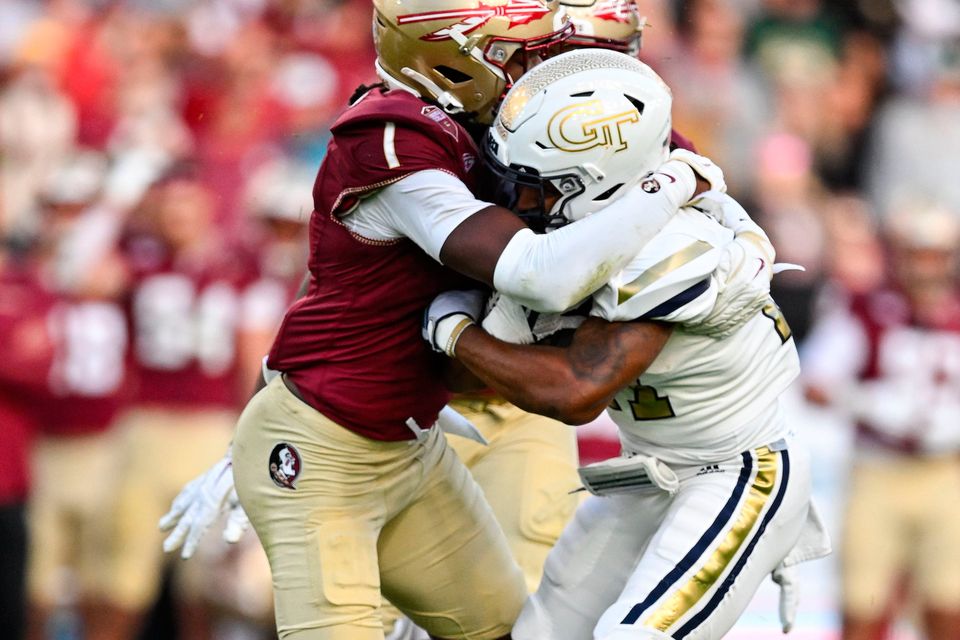 24 August 2024; Georgia Tech Yellow Jackets running back Chad Alexander is tackled by Florida State Seminoles defensive back Shyheim Brown during the 2024 Aer Lingus College Football Classic match between Florida State and Georgia Tech at Aviva Stadium in Dublin. Photo by Brendan Moran/Sportsfile 