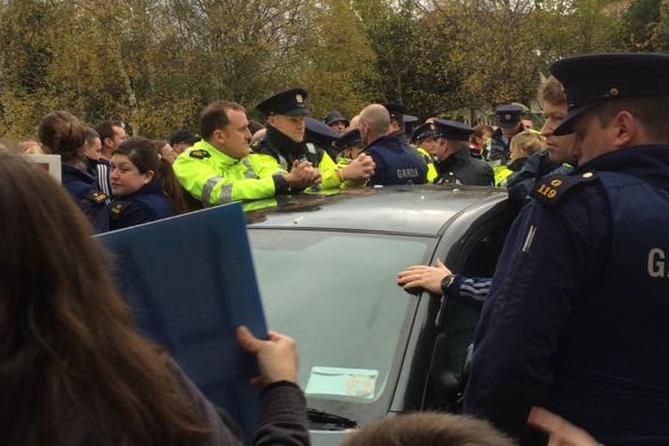 Gardai attended the protest which saw the minister blocked from leaving a community centre in Jobstown, Tallaght. (Photo: Tallaght Says No To Water-Metering/Facebook)