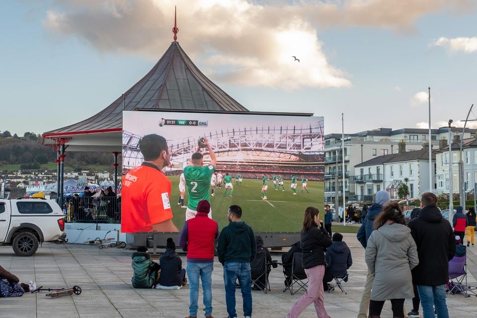 The Ireland v England rugby match on a big screen at the bandstand in Bray.