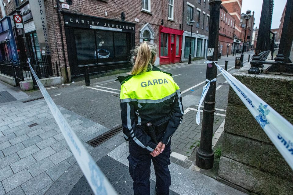 A Garda stands at the scene of a serious assault incident at Cathedral Street in Dublin City centre: Photo: Damien Storan.
