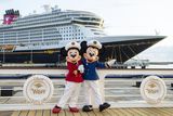 thumbnail: Captain Minnie and Mickey in front of the Disney Wish at Port Canaveral, Florida. PA Photo/Disney Cruise Line/David Roark.