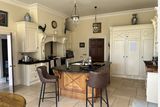 thumbnail: The country-style kitchen is warm and inviting.