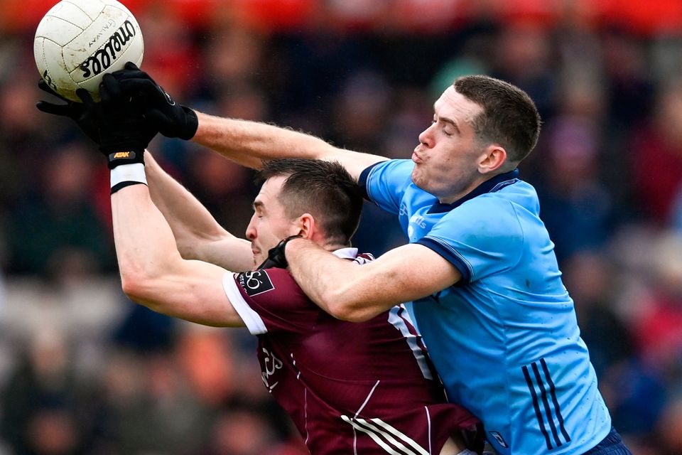 Brian Fenton of Dublin in action against Cein Darcy of Galway