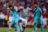 thumbnail: Lionel Messi of Barcelona (L) and Paul Pogba of Machester United (R)