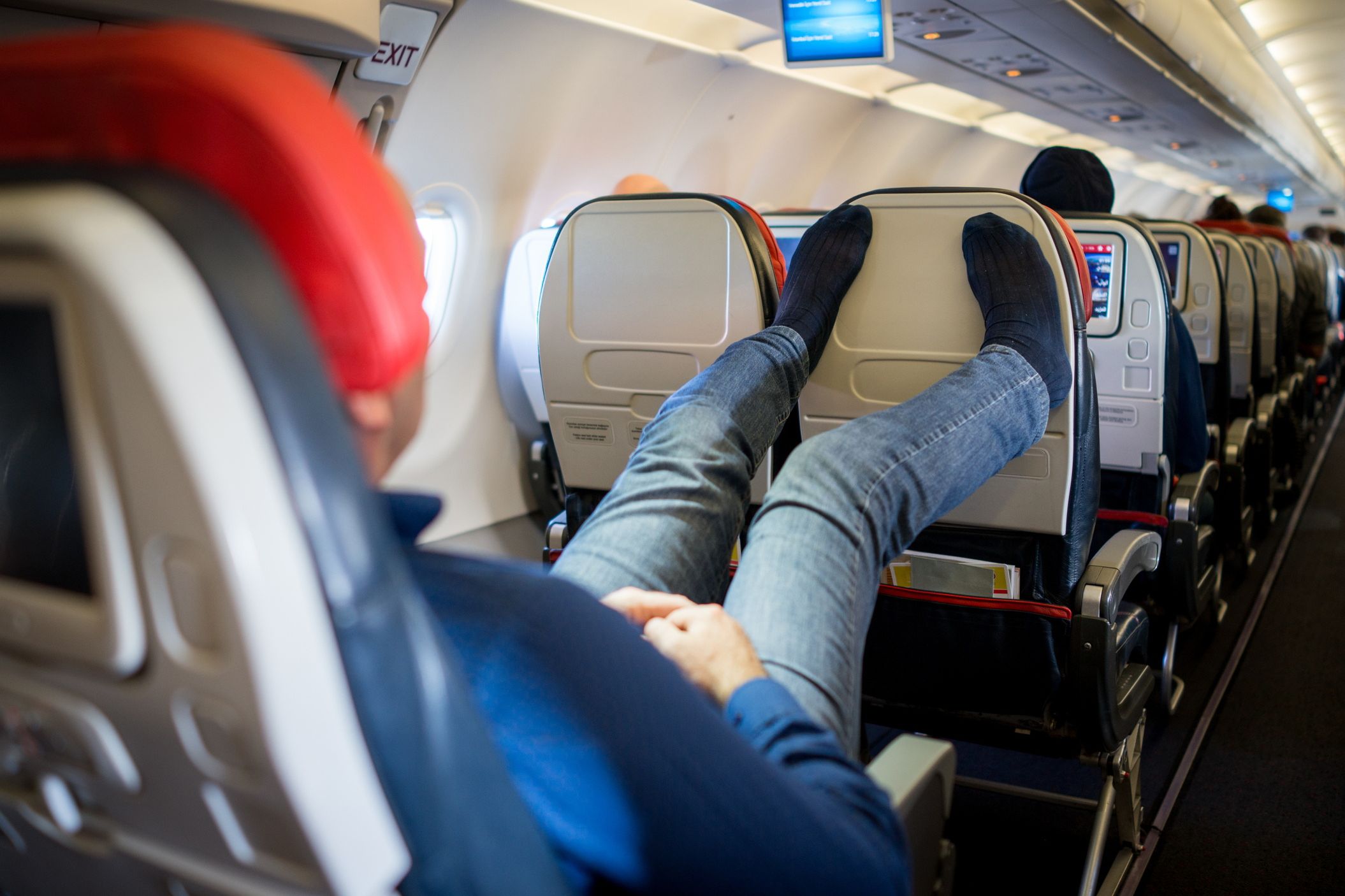 Discover the Top 15 Irritating Airplane Habits: From Arm Rest Hogs to Shoeless Travelers