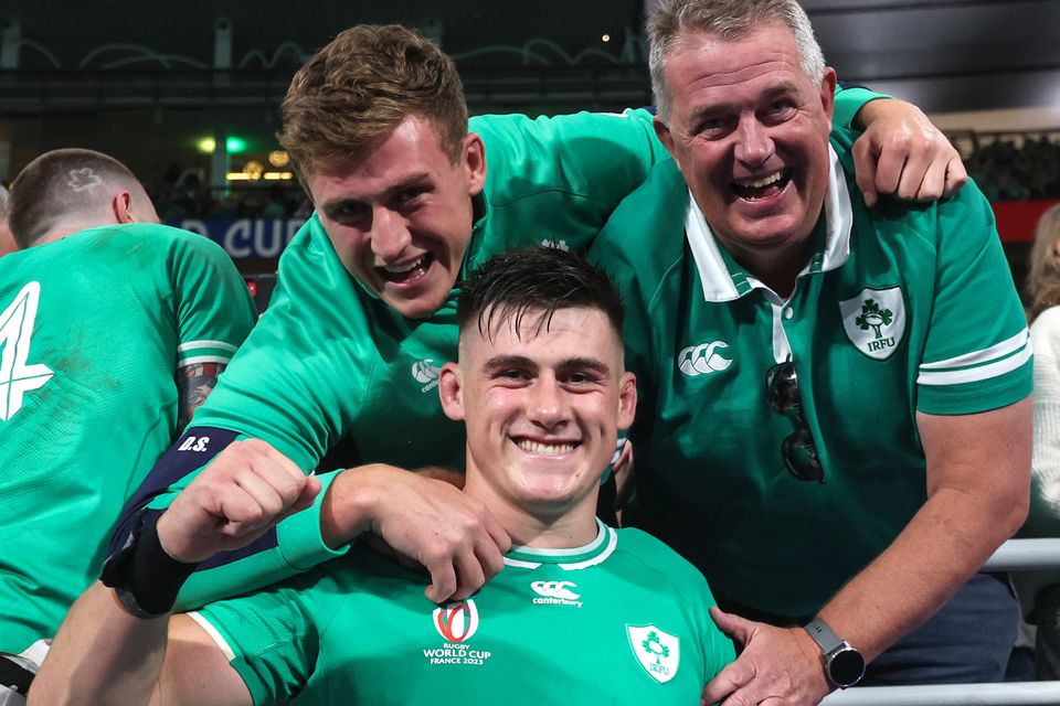 Ireland’s Dan Sheehan celebrates the team's victory over South Africa at last year's World Cup with his father Barry (right) and brother Bobby