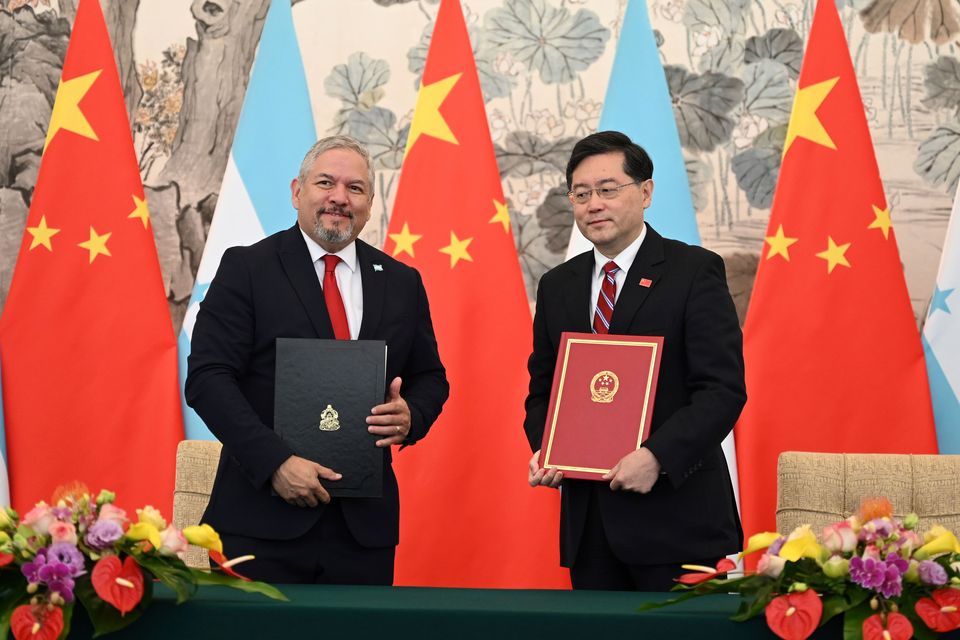 Honduras Foreign Minister Eduardo Enrique Reina Garcia, left, and Chinese Foreign Minister Qin Gang pose with documents following the establishment of diplomatic relations between the two countries, at a ceremony in the Diaoyutai State Guesthouse in Beijing on Sunday, March 26, 2023 (Greg Baker/Pool Photo via AP/PA)