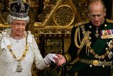 thumbnail: Britiain's Prince Philip (R) takes the hand of Queen Elizabeth II after she addressed politicians at the 'State Opening Of Parliament' in London, 15 November 2006. The British government will publish a long-awaited bill on tackling climate change in the forthcoming session of parliament, Queen Elizabeth II announced Wednesday. One of the key tenets of Prime Minister Tony Blair's final few months in office will therefore involve attempting to set a legacy on slowing global warming -- which his Downing Street office has branded "the biggest long-term threat that we now face."  /WPA POOL/ (Photo by ADRIAN DENNIS / POOL / AFP)        (Photo credit should read ADRIAN DENNIS/AFP/Getty Images)