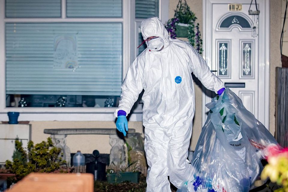 PSNI officers search a house in the Ardoyne area of Belfast where a drug
dealer was arrested on suspicion of murdering Robbie Lawlor