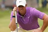 thumbnail: Rory McIlroy lines up a putt on the tenth green