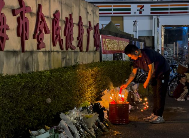 Public mourns 35 killed in attack at sports complex in southern Chinese city