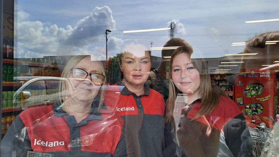 Workers Karen Keating, Jeanette Joyce and Molly Prendergast at Iceland in Coolock stage a sit-in as they claim the store was closed without notice. Photo: Avril Kinsella