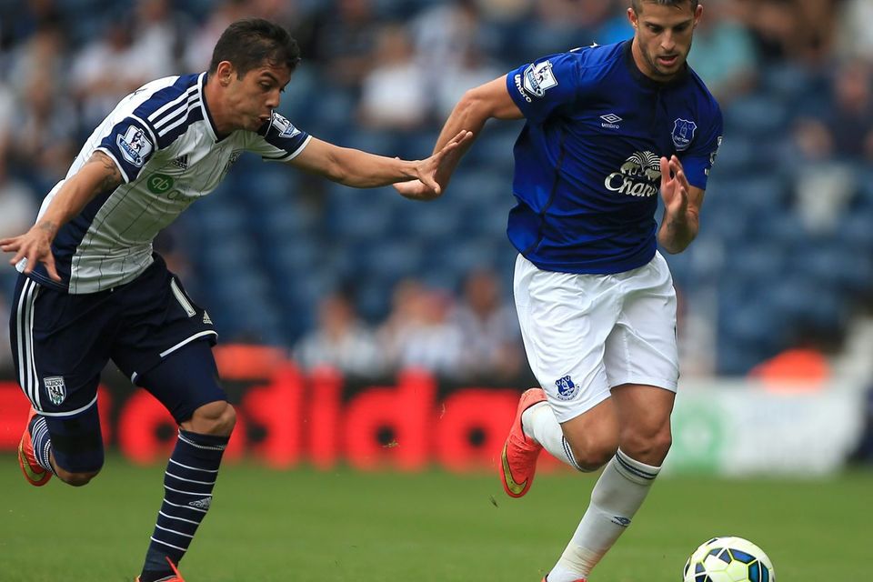 West Brom's Cristian Gamboa battles for the ball with Everton's Kevin Mirallas