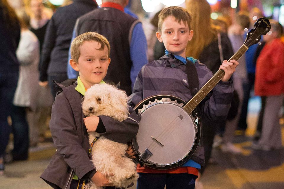 Cathal Fitzgerald, from Tralee, Co Kerry, with ‘Bobby’ and Darragh Claffey, from Dublin, at the Fleadh Cheoil na hÉireann in Ennis, Co Clare. Photo: Eamon Ward