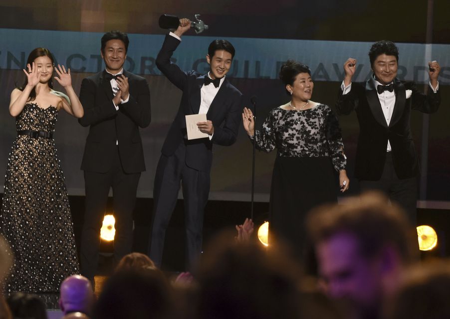 The stars accepting the award for outstanding performance by a cast in a motion picture for Parasite (Chris Pizzello/AP)