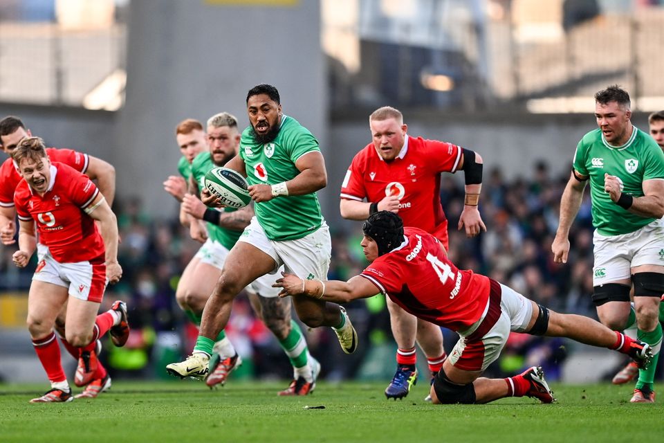Bundee Aki beats the tackle of Dafydd Jenkins during the Guinness Six Nations Rugby Championship match between Ireland and Wales at Aviva Stadium in Dublin. Photo by Ramsey Cardy/Sportsfile