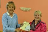 thumbnail: At the presentation of prizes for the May Bush Competition in Teach Raithneach was competition Judge Josephine Sullivan presenting 1st Prize to Bernie Weldon.
